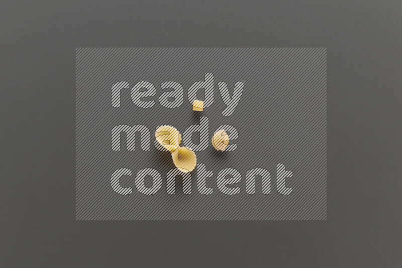 Different pasta types on grey background