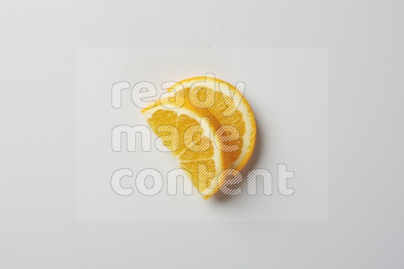 Two halves of an orange slices on white background