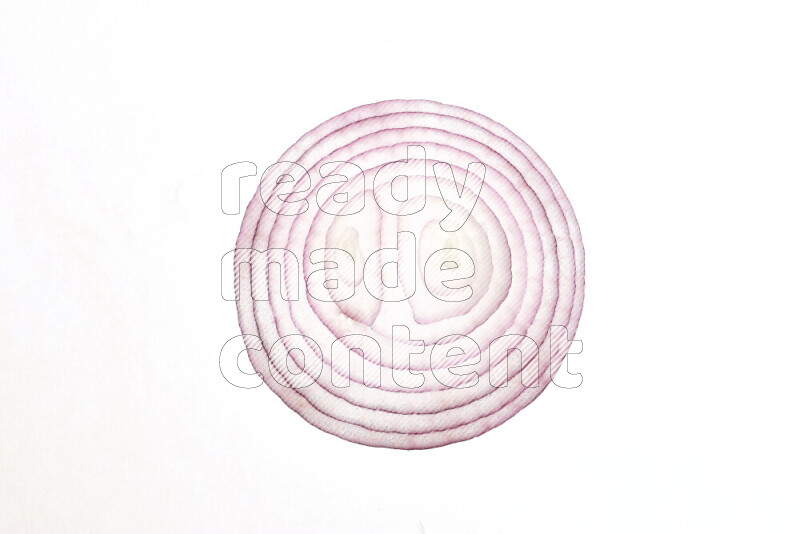 Onion slices on illuminated white background