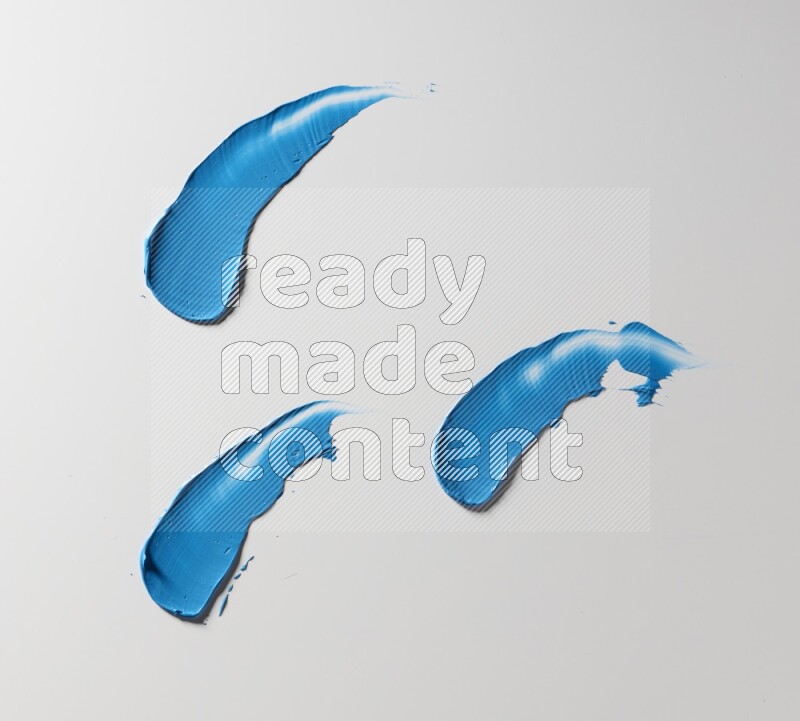 Blue painting knife strokes on white background