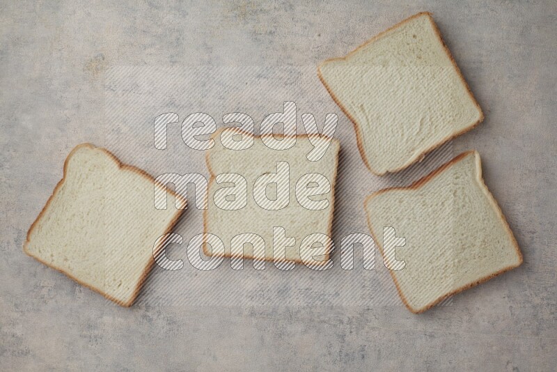 White Toast slices on alight blue textured background