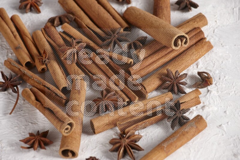 cinnamon sticks with star anise on white background