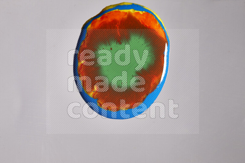 Close-ups of assorted colors blending on a grey background