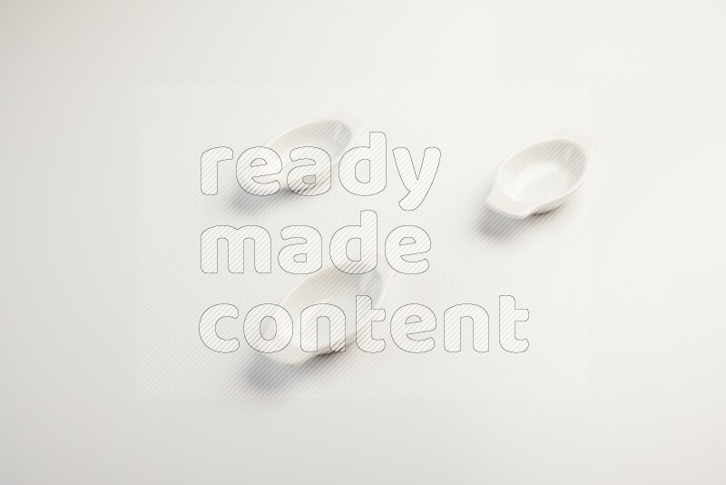 white ceramic oval sauce dish on white countertop