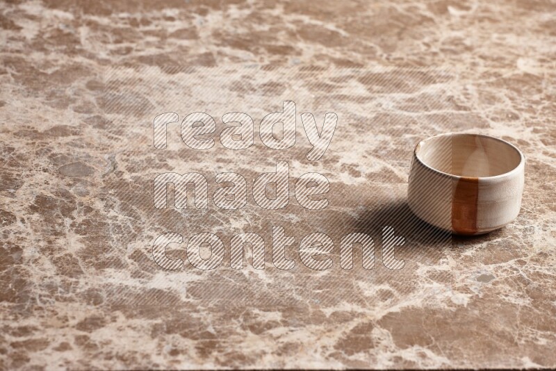 Multicolored Pottery Bowl on Beige Marble Flooring