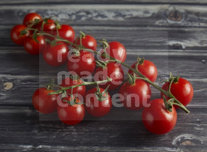 45 cherry tomato vein on a textured grey wooden background
