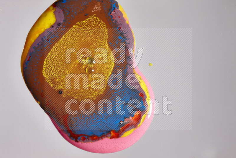 Close-ups of assorted colors blending on a grey background