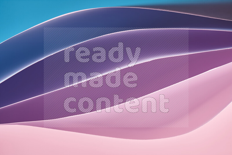 This image showcases an abstract paper art composition with paper curves in blue, purlpe and pink gradients created by colored light