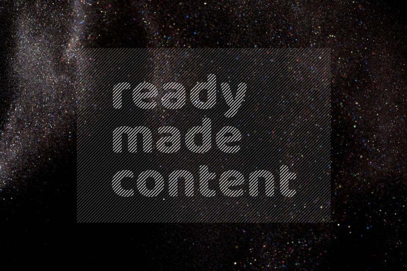 Multicolored glitter powder isolated on black background
