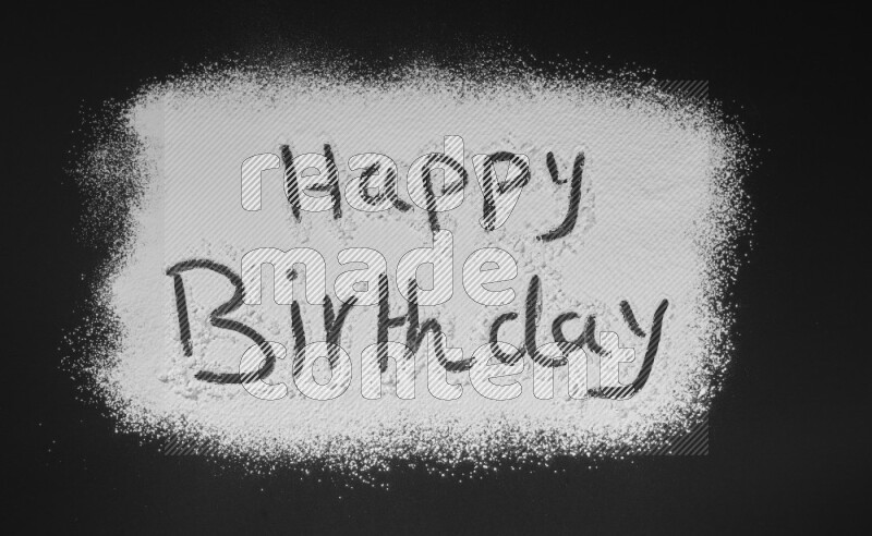 A sentence written with powder on black background