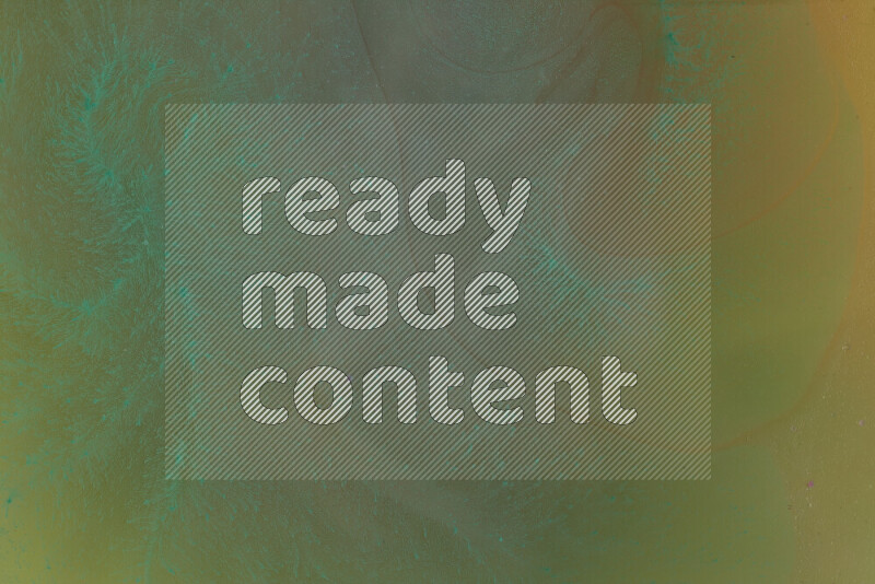 The image captures a dramatic splatter of green paint over a orange backdrop