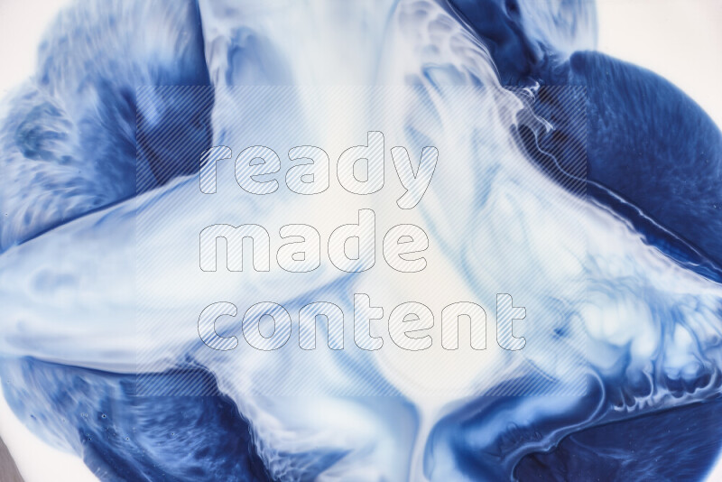 A close-up of abstract swirling patterns in blue and white