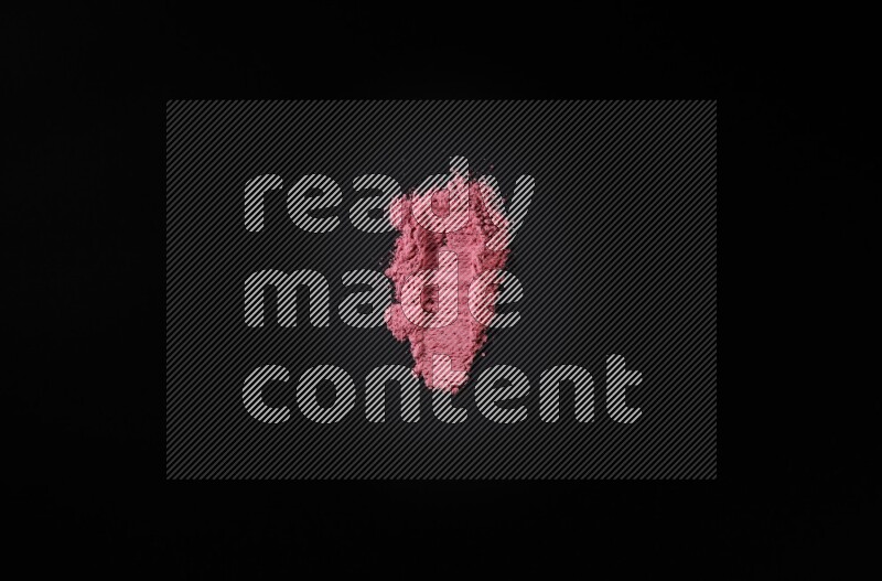 Red powder smears on black background