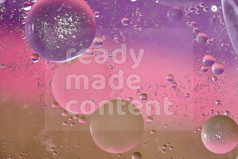 Close-ups of abstract oil bubbles on water surface in shades of brown, purple and pink