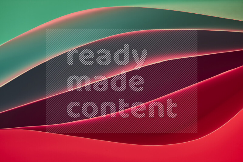 This image showcases an abstract paper art composition with paper curves in green and red gradients created by colored light