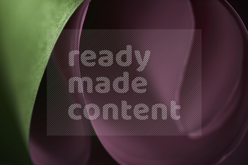 An abstract art piece displaying smooth curves in pink and green gradients created by colored light