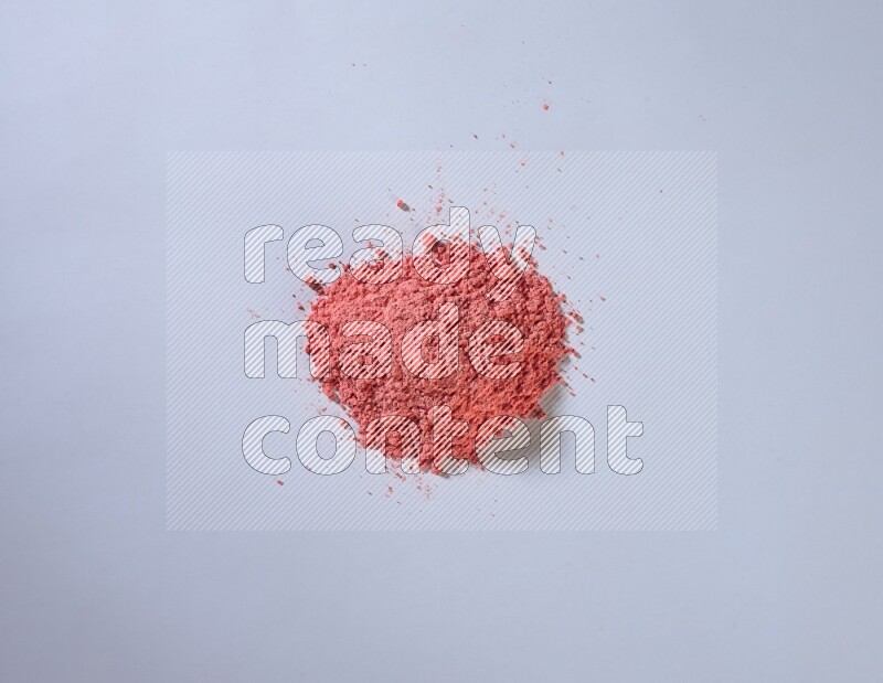 Red powder on white background