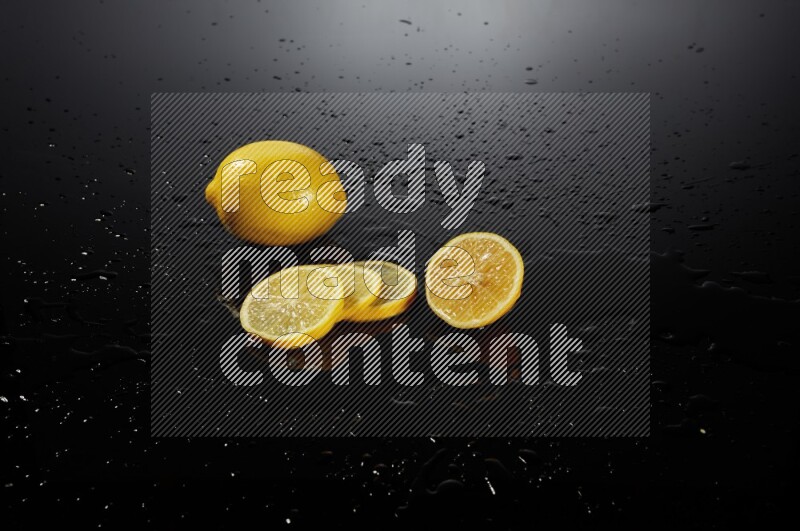 Lemon slices with water drops, and droplets on black background