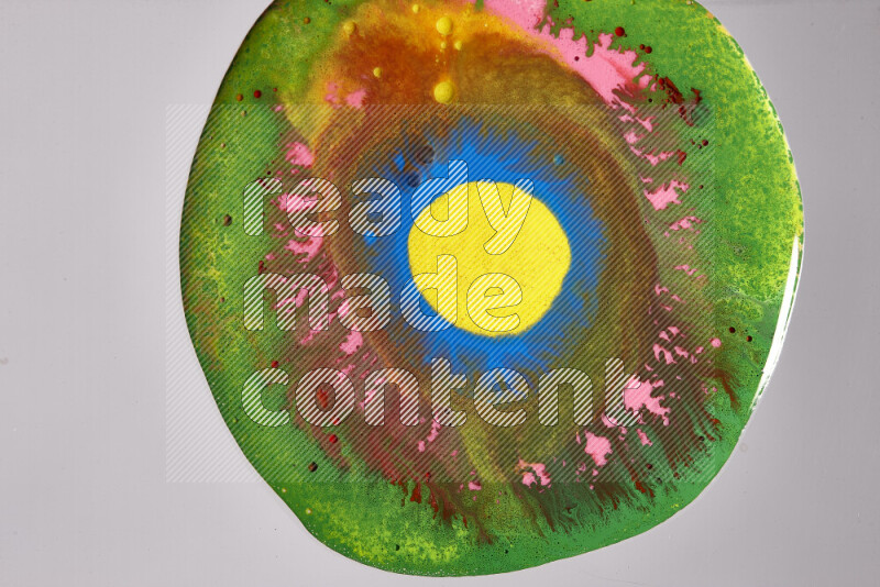 Close-ups of assorted colors blending on a grey background