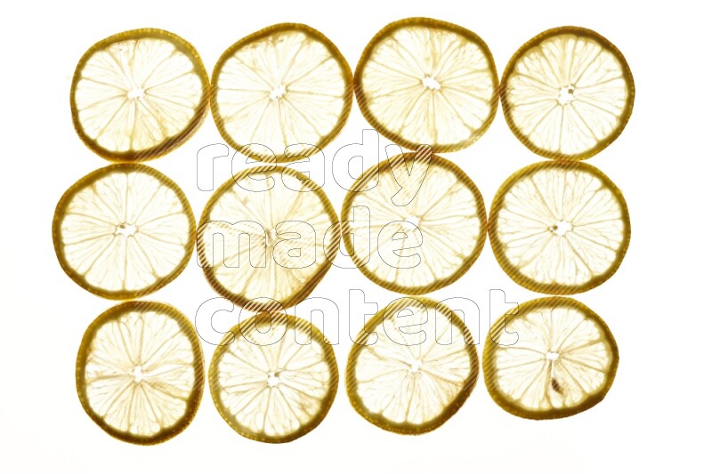 Lemon slices on illuminated white background