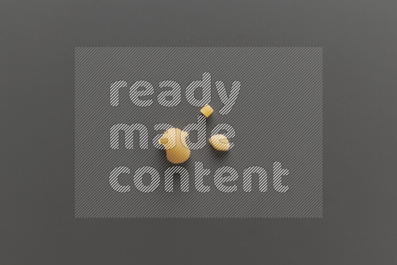 Different pasta types on grey background