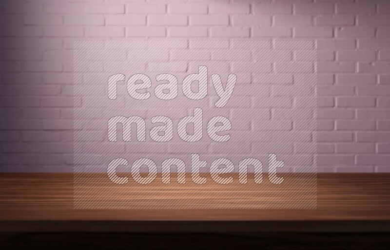 A wooden table top with colored brick wall background