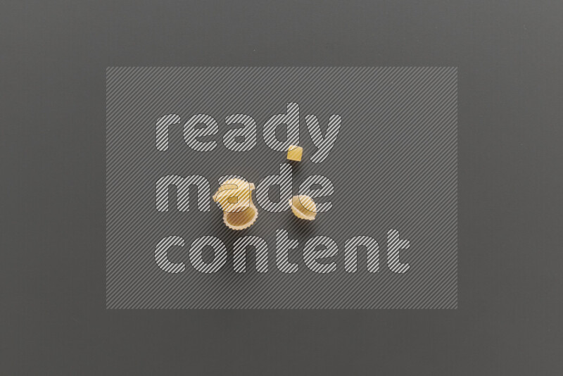 Different pasta types on grey background