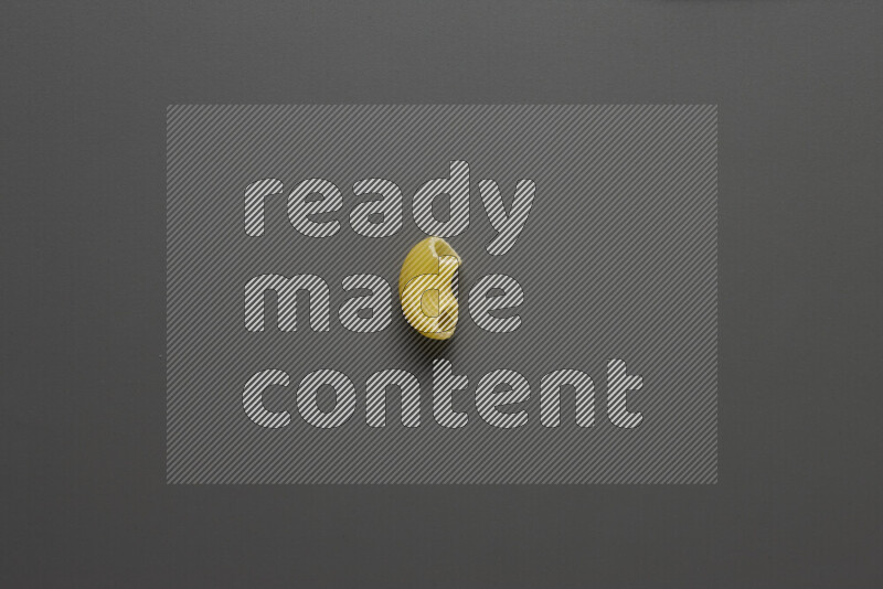 Elbow pasta on grey background