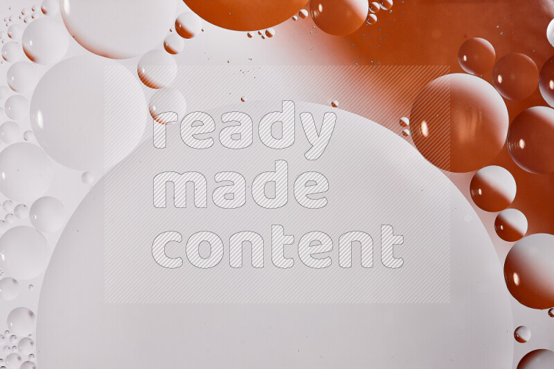 Close-ups of abstract oil bubbles on water surface in shades of white and orange