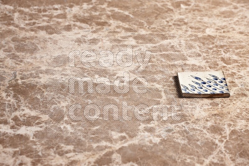 A decorative coaster on beige marble background