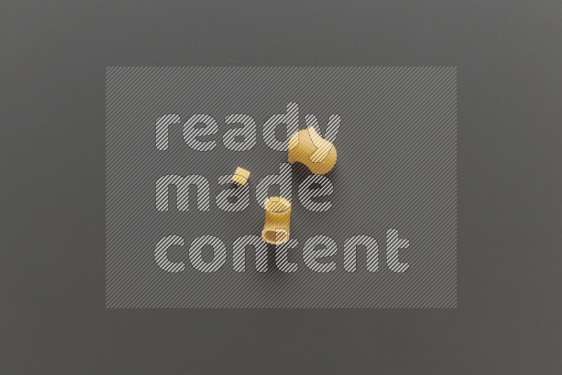 Different pasta types on grey background
