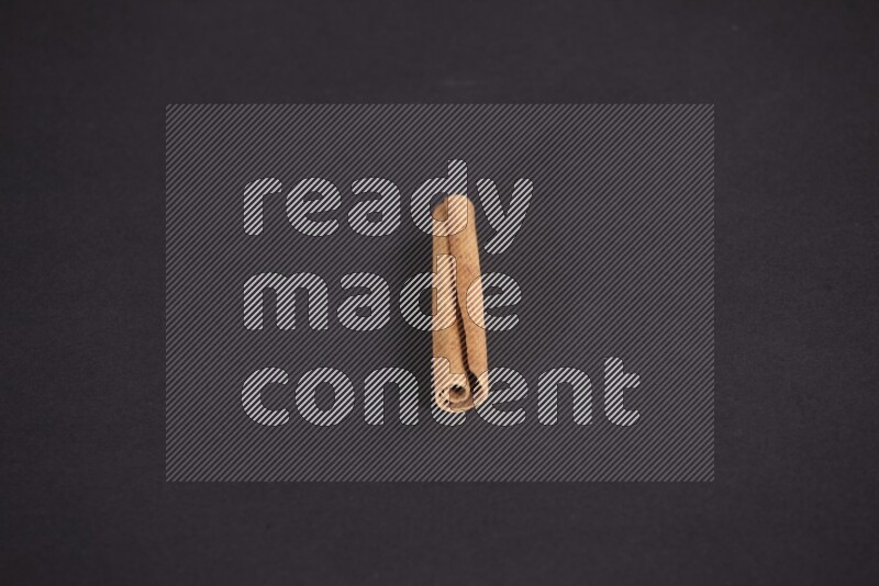 Cinnamon stick on black background