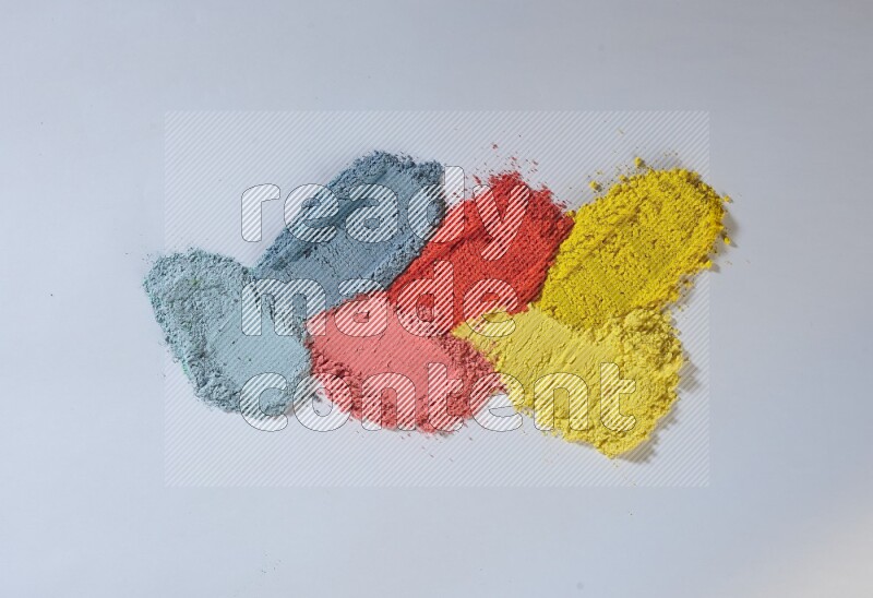 Multicolored powder smears on white background