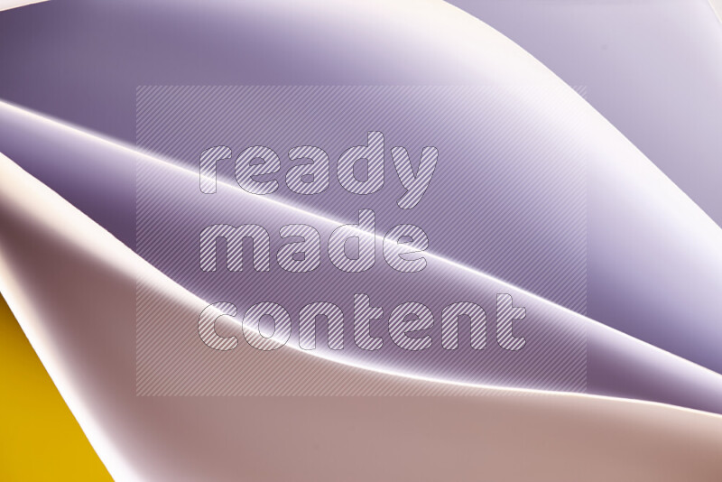 This image showcases an abstract paper art composition with paper curves in white and different warm gradients created by colored light