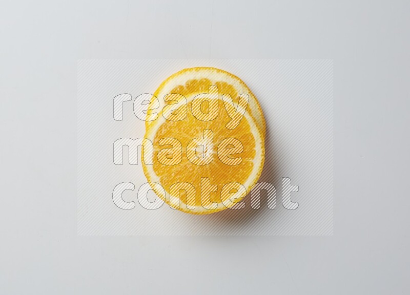 Two orange slices on white background