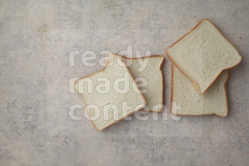 White Toast slices on alight blue textured background