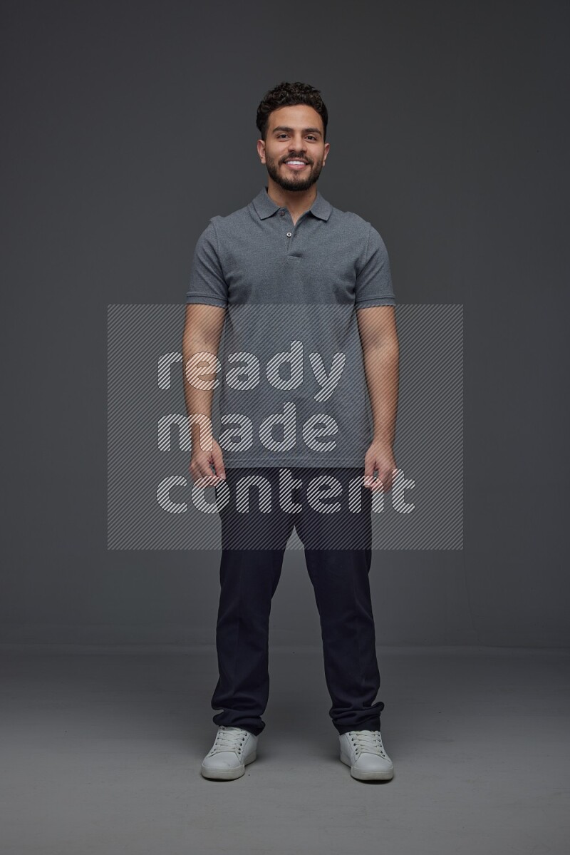 A man wearing casual making multi stand poses  eye level on a gray background