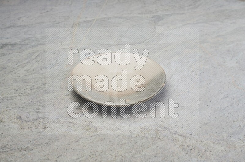 Multicolored Pottery Plate On Grey Marble Flooring