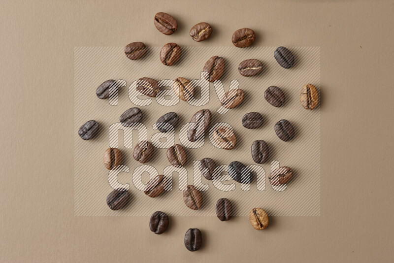 Roasted coffee beans on beige background
