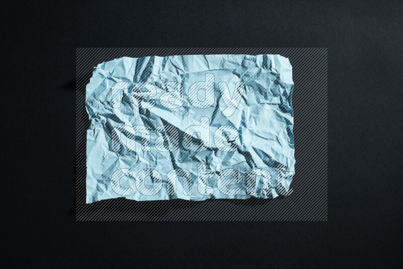Blue paper sheet on black background