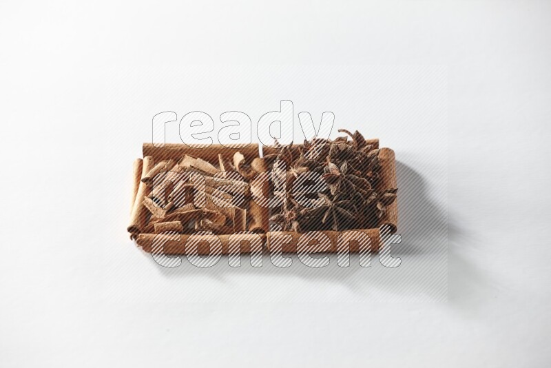 2 squares of cinnamon sticks full of star anise and cinnamon on white flooring