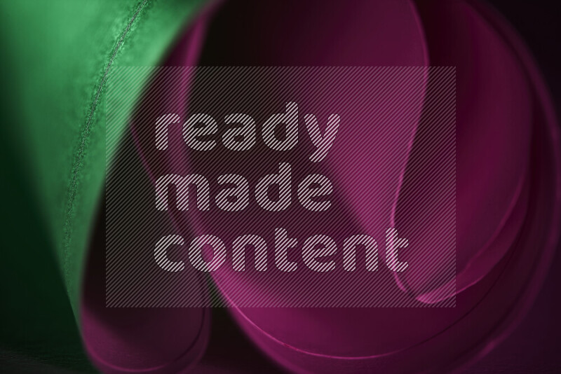 An abstract art piece displaying smooth curves in pink and green gradients created by colored light