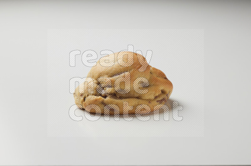 a chocolate chip cookie on a white background