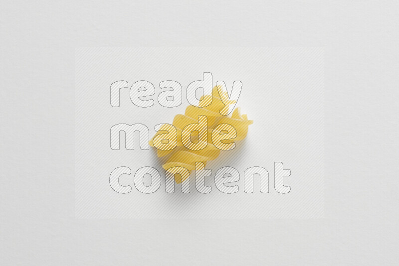 Fusilli pasta on white background