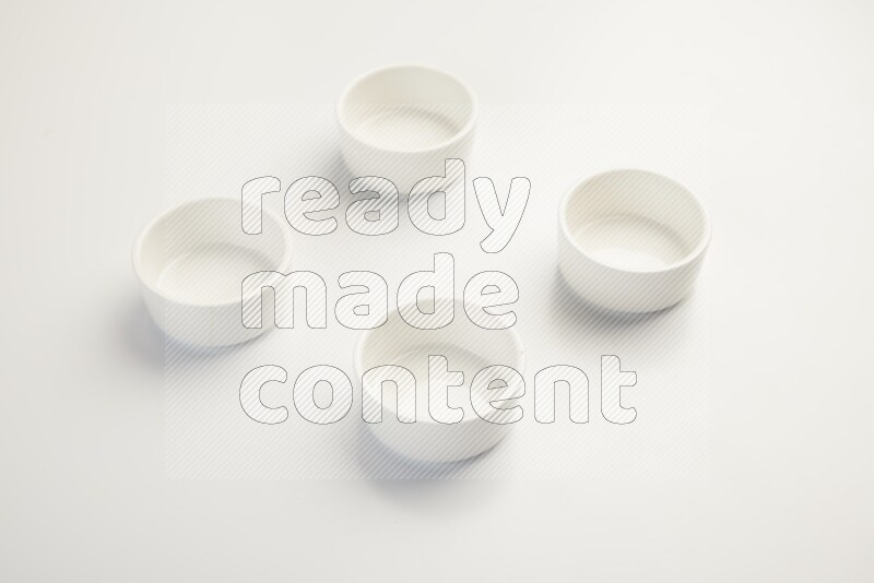 white ceramic round sauce dish on white countertop