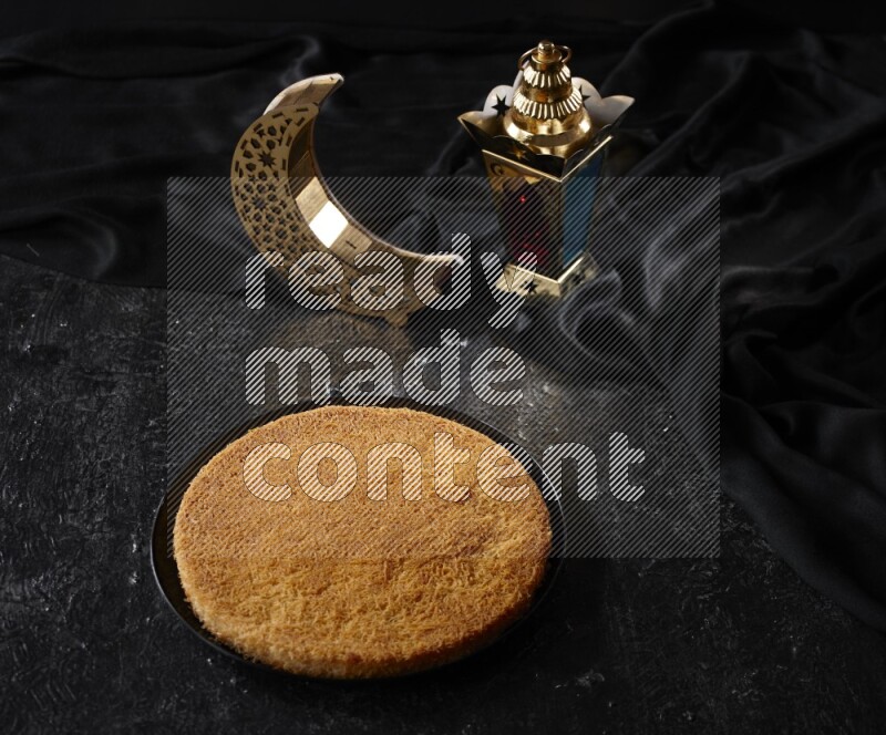 Konafa with lanterns in a dark setup