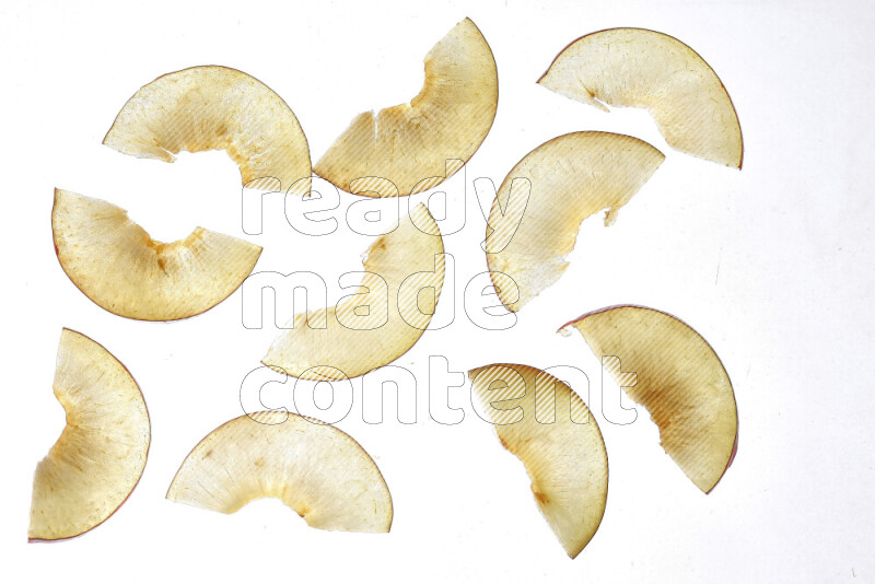 Peach slices on illuminated white background