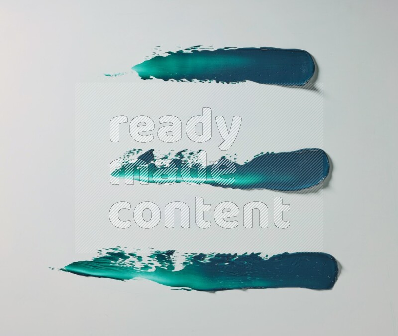 Turquoise painting knife strokes on white background