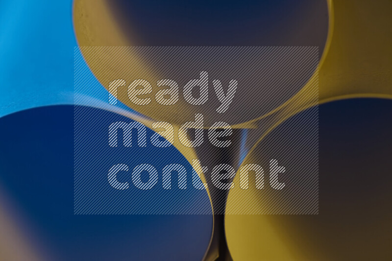 The image shows an abstract paper art with circular shapes in varying shades of blue and warm tones